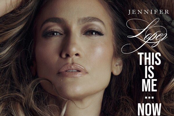 This image released by BMG shows cover art for “This Is Me…. Now” by Jennifer Lopez. (BMG via AP)