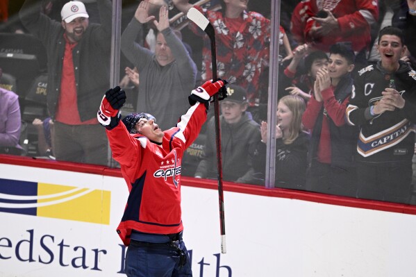 Washington Capitals center Dylan Strome celebrates his game-winning goal during overtime of an NHL hockey game against the Detroit Red Wings, Tuesday, March 26, 2024, in Washington. The Capitals won 4-3 in overtime. (AP Photo/Nick Wass)