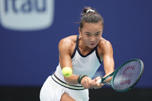 Yue Yuan, of China, returns a ball from Maria Sakkari, of Greece, in their women's second round match at the Miami Open tennis tournament, Thursday, March 21, 2024, in Miami Gardens, Fla. (AP Photo/Rebecca Blackwell)
