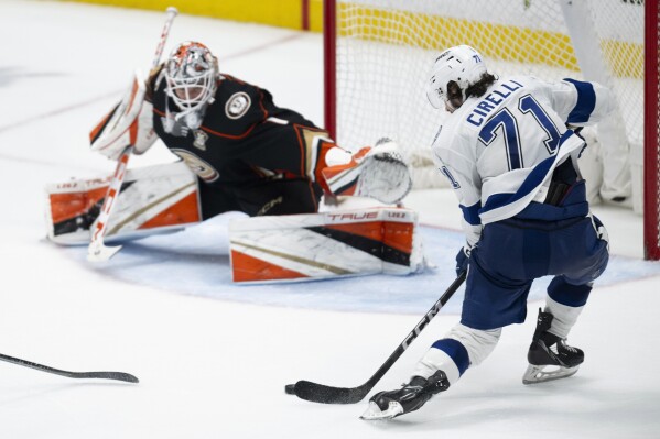 Tampa Bay Lightning center Anthony Cirelli (71) shoots for the game-winning goal during the overtime of an NHL hockey game against the Anaheim Ducks, Sunday, March 24, 2024, in Anaheim, Calif. Lightning won 3-2. (AP Photo/Kyusung Gong)