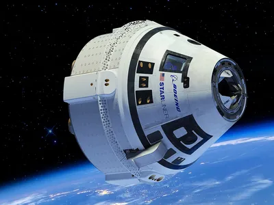 An illustration of the Boeing CST-100 Starliner spacecraft, currently docked to the International Space Station as engineers troubleshoot helium leaks and thruster issues.