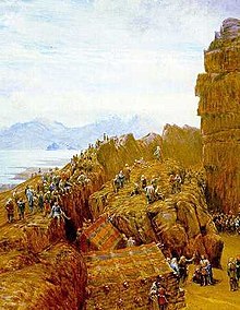 Painting of a rocky outcrop with people gathered around, a central figure stands at the top