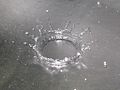 A drop of water hitting a metal surface/ crown formation due to splashing of droplet.