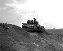 KOREAN WAR Marine Pershing tanks grind up heights along Naktong and give close support to Leathernecks driving enemy backward.