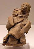 Древна фигурка, изобразяваща раждаща жена
