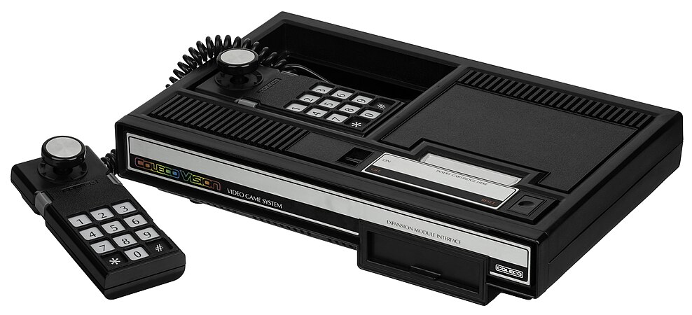 The Collecovision with a controller taken out from the holder.