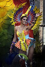 A woman on float parade waves during the annual Aliwan Fiesta along Roxas Boulevard in Manila. Photograph: Ranieljosecastaneda (CC BY-SA 4.0)