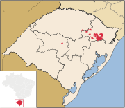 Municipalities in which Talian is co-official in Rio Grande do Sul, Brazil, highlighted in red: Bento Gonçalves,[21] Caxias do Sul,[22] Flores da Cunha,[23] Nova Roma do Sul,[24][25] and Serafina Corrêa.[26]