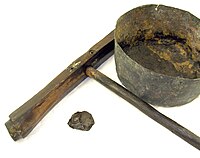 A caulking mallet, tar pot and a piece of petrified tar found on board the 16th century carrack Mary Rose