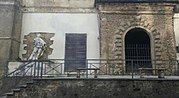 Portale est dell'ex palazzo Ducale con statua del duca Fabrizio Caracciolo opera di Bartolomeo Mori nel 1669