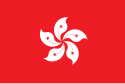 Et flag med et femtakket blomsterdesign på en helt rød baggrund