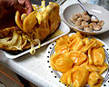 Extracting the jackfruit arils and separating the seeds from the sweet flesh.