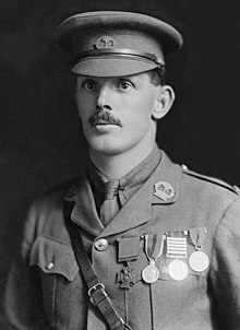 Head and shoulders portrait of a man in military cap and uniform