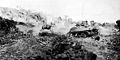 Fighting toward Hill 89, tanks of the 769th Tank Battalion attack a bypassed Japanese strong point.