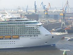 Cruise ship Freedom of the Seas, with drydock Elbe 17 on the background
