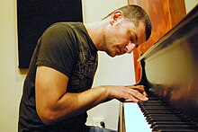 Roy Zu-Arets plays the piano in his studio in Hollywood