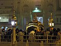 Devotees surround the Palki Sahib, the palanquin carrying the Adi Granth.