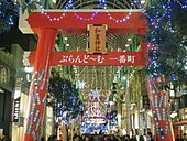A temporary Torii for new year celebration in a shopping street decorated with Christmas lights