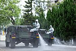 Taiwanese 33rd Chemical Corps spraying disinfectant on a street in Taipei