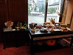 Cheese, coldcuts, and bread station in brunch buffet