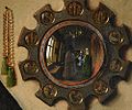 Phối cảnh cong: tấm gương lồi trong bức Chân dung Arnolfini (1434) của họa sĩ Jan van Eyck.