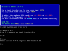 A command-line interface with a blue text box, followed by a command line. The text box contains text welcoming the user, providing DOSBox instructions, and linking the URL to the official website.