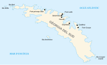 mapa de l'illa de Geòrgia del Sud i altres illes en alta mar. Geòrgia del Sud té una forma irregular, allargada, amb moltes coves i badies profundes. A la costa nord hi ha les principals estacions de pesca baleneres: Príncep Olav Harbour, Port Leith, Stromness, Husvik, Grytviken, Godtul i Port d'Oceà.