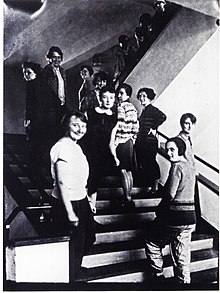 Many women seen going up and down the stairs of the Bauhaus
