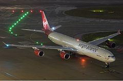 Virgin Atlantic on apron at night from above
