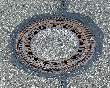 Round manhole cover on manhole