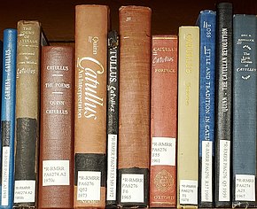 A library bookshelf containing several books on Catullus. Titles include: "Catullus: An Interpretation", "Style and Tradition in Catullus", and "The Lyric Genius of Catullus".
