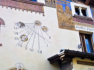 Sundial on a side facade of the Fairy House in the Coppedè Quarter, Rome