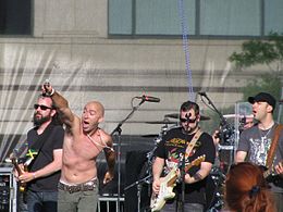 Live onstage with Ed Kowalczyk pointing his microphone to the crowd