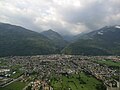 Panorama della città dalla Costiera dei Cech. Sullo sfondo le Valli del Bitto nelle Alpi Orobie Valtellinesi