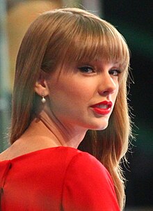 Taylor Swift in a red dress.
