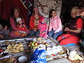 Women and children eating in Suusamyr Valley