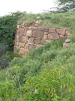 The bastion of Lal Kot fort in Delhi's Mehrauli built by Tomara Rajput ruler, Anangpal in c. 736 CE.[୬]