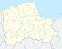 Mapa konturowa województwa pomorskiego, blisko centrum u góry znajduje się punkt z opisem „Żukowo”