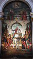 Pala d'altare di Vittore Carpaccio raffigurante San Vitale a cavallo fra otto santi, conservata nella chiesa di San Vidal a Venezia. Il santo è raffigurato a cavallo in età adulta con l'insolito attributo della scure