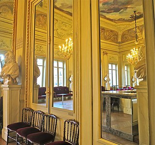 Mirrors of the foyer multiply the space