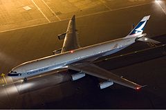 Cathay Pacific on apron from above at night