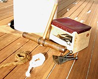 The tools of traditional wooden ship caulking: caulking mallet, caulker's seat, caulking irons, cotton and oakum