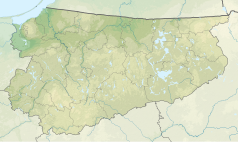 Mapa konturowa województwa warmińsko-mazurskiego, po lewej nieco na dole znajduje się punkt z opisem „ujście”