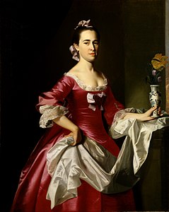 Doamna George Watson, de John Singleton Copley, 1765. Rochia roșie din satin a unui negustor înstărit din Boston arată succesul economic al soțului
