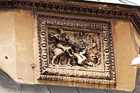Фасад каплиці Боїмів. «Георгій змієборець», рельєф в маньєристичній рамі.