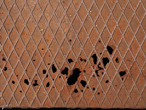Rust holes in the manhole cover