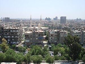 View of Damascus from a bank of Barada river.