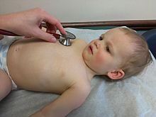 Physical exam of child with stethoscope on chest.jpeg
