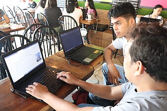 Irvin tutors a WikiGap participant