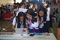 A student signs up at the Wikipedia registration booth.
